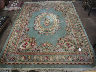 A green ground and floral patterned Chinese rug 149" x 110"