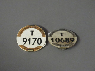 A Metropolitan Stage Coach bus drivers badge T10689 and a Conductor's badge T9170