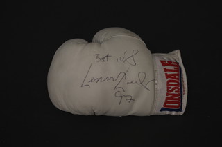 A Lonsdale left handed boxing glove signed Best Wishes Lennox  Lewis '97  ILLUSTRATED