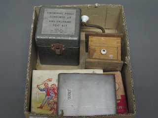 A swimming pool combined PH and Chlorine test kit, boxed, a  miniature pepper mill, pair of hair clippers, chrome cigarette case  and a set of needles