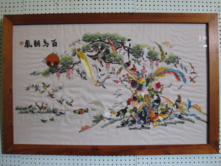 An Oriental silk embroidered panel depicting a lake with birds  and trees 20" x 33"