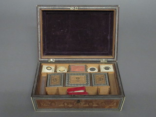 A carved Eastern sewing box with hinged lid, the interior fitted  ivory cotton reels etc 9 1/2"