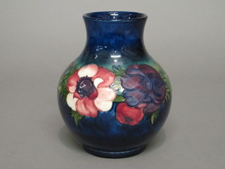 A Moorcroft blue glazed vase decorated Anemone, the base  signature and marked Potter to the Queen, 7"  ILLUSTRATED