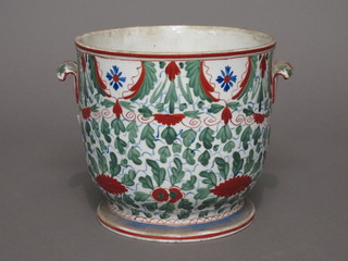 A porcelain twin handled jardiniere the base with star crack,  marked M106 7"