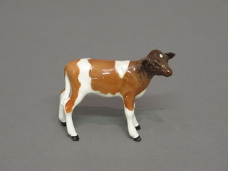 A Beswick figure of a standing brown and white Ayrshire calf,  3"