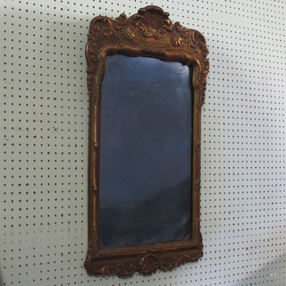 A rectangular shaped plate mirror contained in a gilt frame 28" 