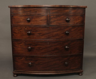 A 19th Century mahogany bow front chest of 2 short and 3 long drawers with tore handles, raised on bun feet 47"