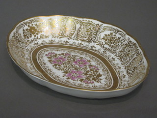 An 18th Century Derby boat shaped bowl with gilt and floral decoration, the base with cypher mark 11",