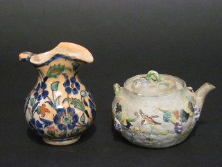A Persian style pottery jug 4" with floral decoration, f, together with an Eastern teapot