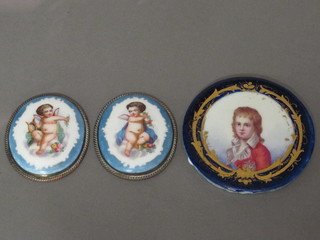 2 oval circular porcelain plaques decorated cherubs 2" and a  circular porcelain plaque decorated a gentleman 3"