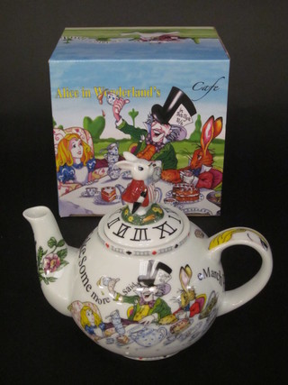 A Dartington cylindrical etched glass vase marked 25 9" together  with a Poole Alice in Wonderland teapot