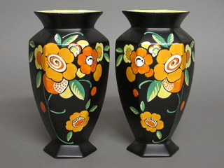 A pair of Falkenware Lido octagonal black glazed vases with floral decoration 10", 1 with star crack to base,