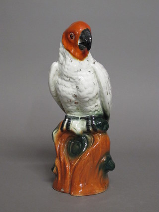 A pottery figure of a seated parrot 13"