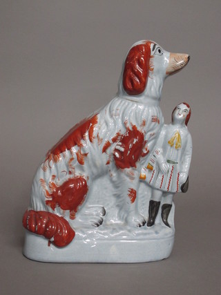 A Staffordshire figure of a seated Spaniel and child 12"