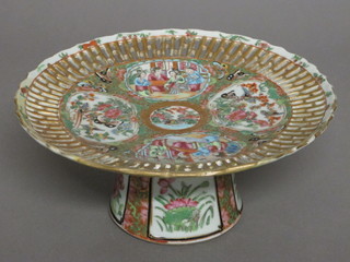 A circular canton famille rose porcelain comport decorated court figures, f and r to edge,