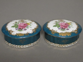 A pair of green and white porcelain trinket boxes and covers 6"