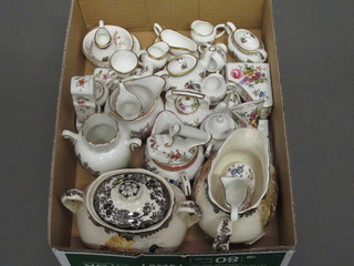 A collection of various Coalport miniature china plates, teapots  etc