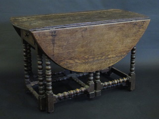 A 17th/18th Century oak and walnut drop flap gateleg dining  table, the base fitted 2 drawers with double gate, raised on  bobbin turned supports 46"