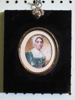 A portrait miniature "Bonnetted Lady in a Blue Dress"  monogrammed A R 1810, cracked, 2 1/2"