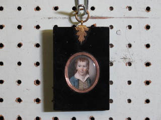 An oval portrait miniature "Boy in Blue Coat" 1" contained in a gilt mounted and ebony frame