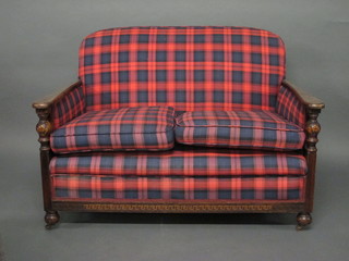 A 1930's oak show frame 2 seat settee and 2 matching armchairs upholstered in tartan material