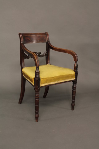 A 19th Century mahogany bar back desk chair, the mid rail  carved a shell and with upholstered seat, raised on turned supports