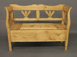 A Continental stripped and polished pine settle 48"