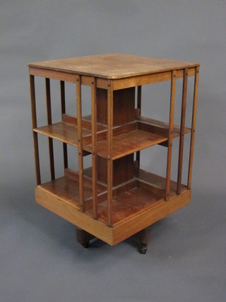 A Victorian square bleached mahogany 2 tier revolving bookcase  20"