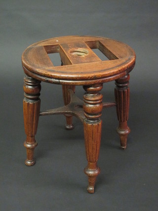 A William IV circular mahogany piano stool base, raised on 4 turned and reeded supports 13"