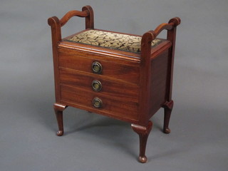 A rectangular mahogany piano stool the base fitted 3 drawers, raised on cabriole supports 21"