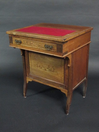 An Edwardian inlaid mahogany Davenport, the hinged lid fitted a stationery box above 1 long drawer, the pedestal fitted 1 long  drawer and cupboard with fall front, raised on square tapering  supports 23"
