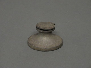 A circular silver capstan inkwell, 2 1/2"