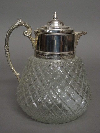 A cut glass globular shaped insulated jug with silver plated mount  ILLUSTRATED