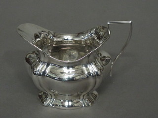 A shaped silver cream jug, marks rubbed, 2 ozs