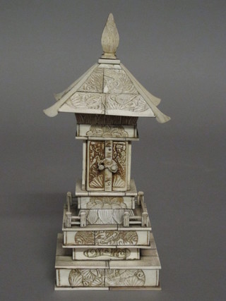 A carved ivory Pagoda with Deity, 10"  ILLUSTRATED