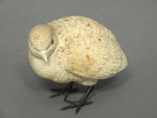 A carved ivory figure of a seated Quail with glass eyes, 1  missing and chip to beak, 3"  ILLUSTRATED