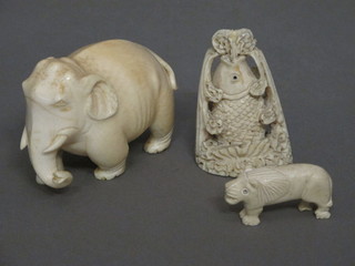 A carved ivory figure of a walking elephant 3", do. fish 3" and a  small tiger 1"