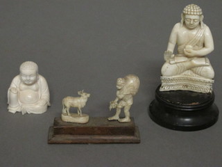 A carved ivory figure of a seated Buddha 3", 1 other 2" and a  do. figure group