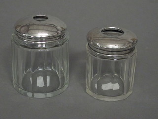 2 octagonal glass hair tidies with silver lids