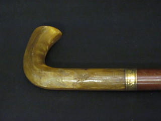 A Malacca cane with gilt band and horn handle
