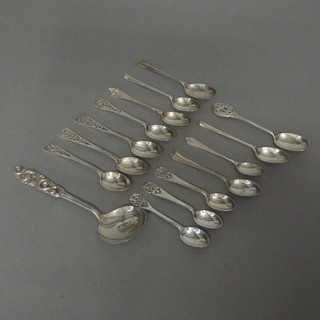 3 silver coffee spoons with pierced stems, 7 other teaspoons, 3  1/2 ozs and a pierced white metal serving spoon