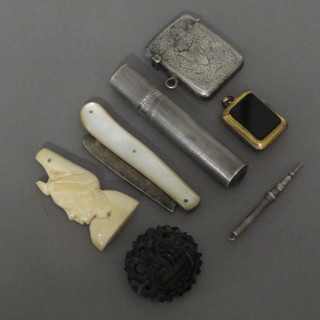 A Sterling silver lighter, an engraved silver vesta case, a propelling pencil, a bog oak brooch, silver bladed pocket knife  with mother of pearl grip, an ivory portrait brooch and a gilt  metal and polished hardstone locket