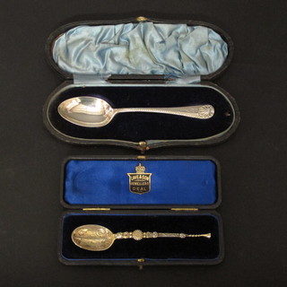 A silver gilt model of an anointing spoon, London 1901 together with a silver teaspoon, both cased,