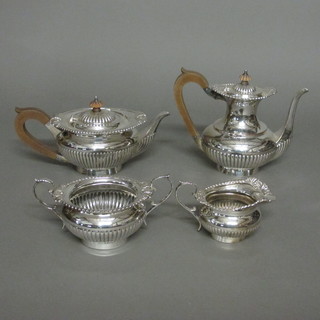 A handsome Georgian style circular 4 piece silver plated tea/coffee service with demi-reeded decoration, comprising  teapot, coffee pot, sugar bowl and milk jug   ILLUSTRATED