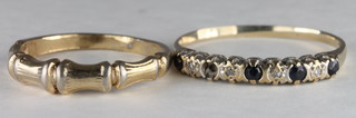 A gold dress ring set white and blue stones, 1 missing, and 1  other gilt dress ring