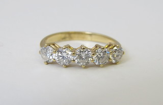 A gold hoop half eternity ring set diamonds, approx 1.5ct