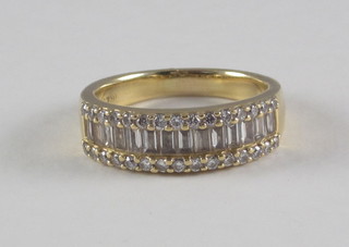 An 18ct yellow gold half eternity ring set baguette cut diamonds