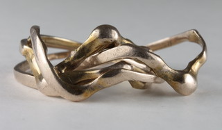 A gilt metal puzzle ring
