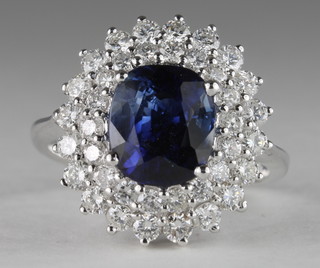 An 18ct white gold dress ring set an oval sapphire, approx 2ct, surround by diamonds, approx 1ct,  ILLUSTRATED
