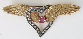 A gold wing brooch, the centre section fitted a heart inset  diamonds and ruby